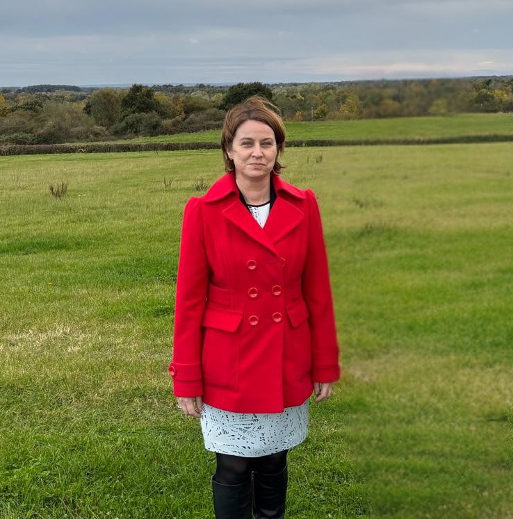 Amanda Hack MP standing in a rural setting