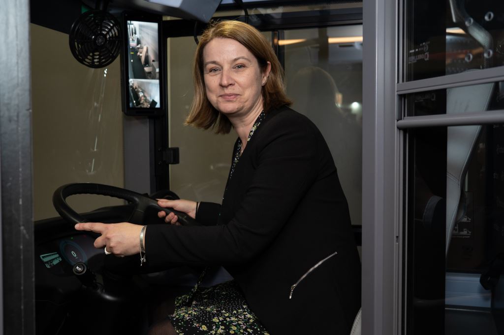 Amanda Hack MP in the driving seat of a bus