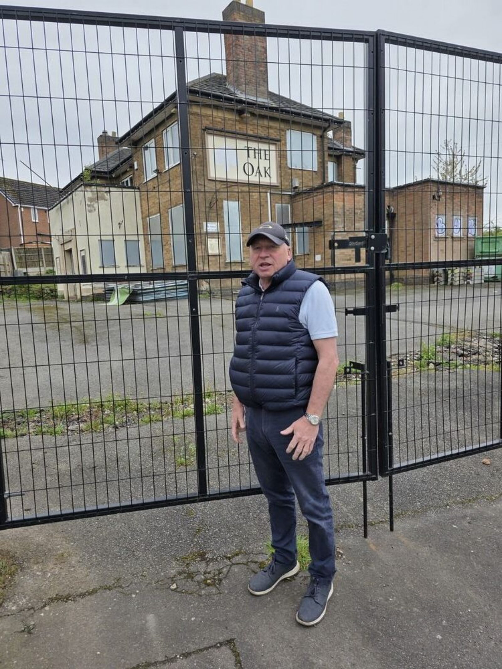 Cllr Peter Moult outside the derelict Oak pub in Whitwick